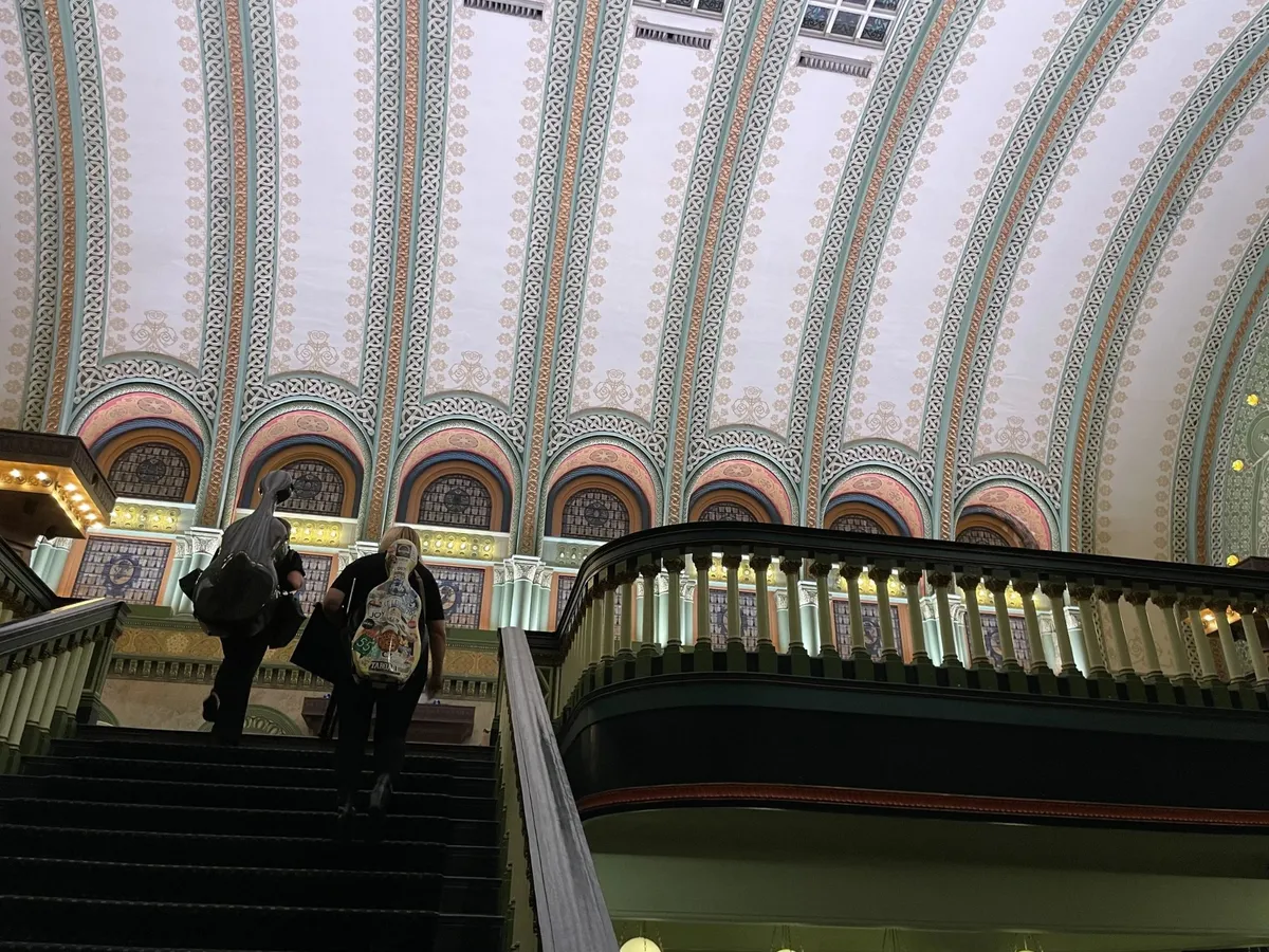 Project String Quartet musicians walking up the grand staircase at Union Station St. Louis